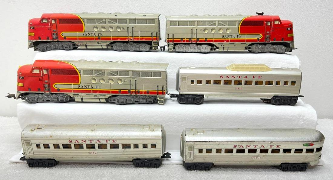 Postwar Marx O Gauge three 21 Santa Fe diesel 3152 3152 3197 passenger: Postwar Marx O Gauge three 21 Santa Fe diesel locomotives (1 powered 2 dummy), 3152 coach, 3152 vista dome, 3197 observation, illuminated passenger cars. Locos have missing horn trim, some cars have s