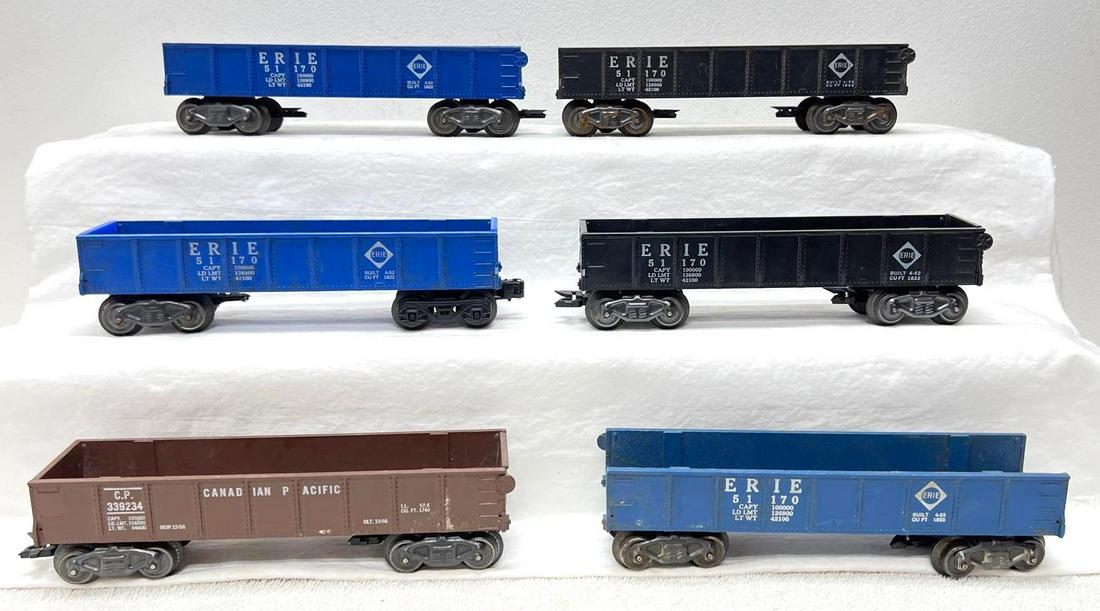Postwar Marx O Gauge five 51170 Erie gondola 339234 CP gondola: Postwar Marx O Gauge five 51170 Erie gondola, 339234 Canadian Pacific CP gondola, with removable ends. One black Erie car is missing ends, one blue Erie has a nut and bolt holding truck on. Trains sho