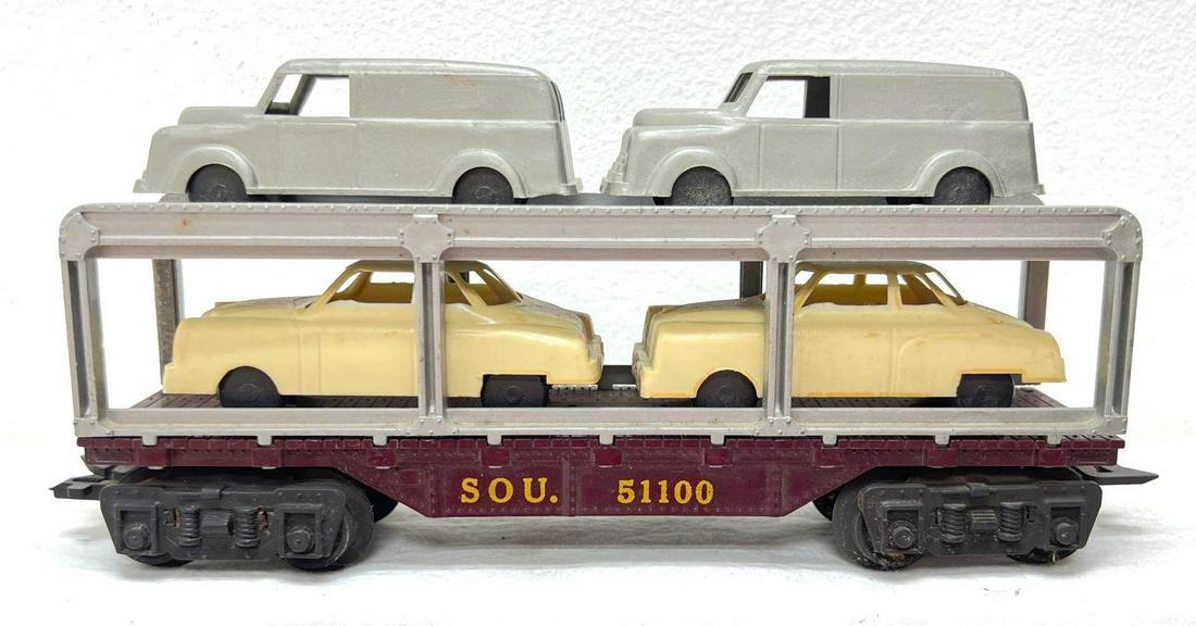 Postwar Marx O Gauge SOU 51100 auto carrier flat car with original load: Postwar Marx O Gauge SOU 51100 auto carrier flat car with original load. Train is very dirty on one side, other is fairly clean. Some light surface rust on underside. Train should clean to look C6. Pl