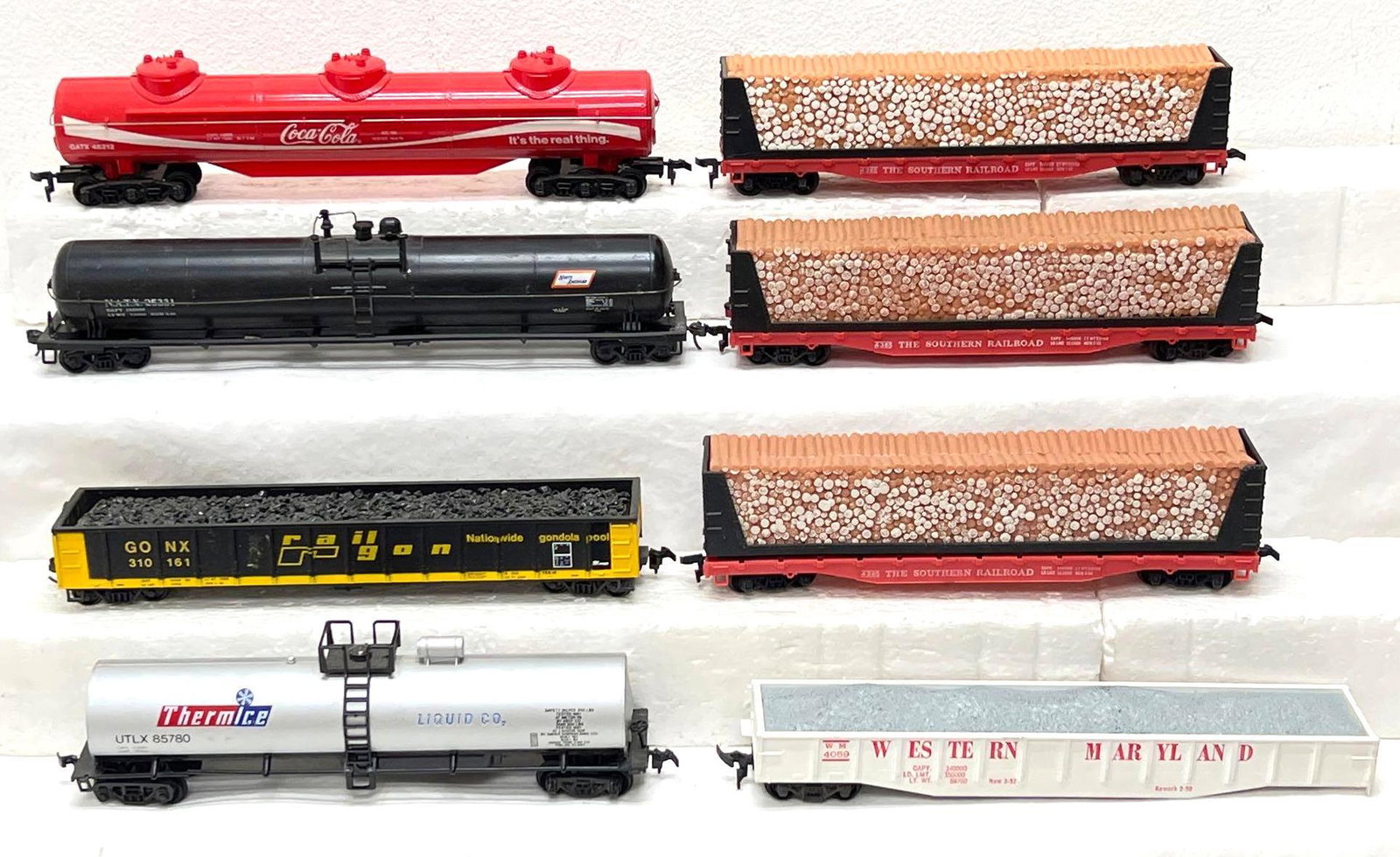 HO Gauge/Scale Tyco lumber cars 3d tanks gondolas: HO Gauge/Scale Tyco lumber cars 3d tanks gondolas, some trains have a missing step(s), North American tank is missing an upright for catwalk railing, etc. Trains otherwise look C6-7. Please view the p