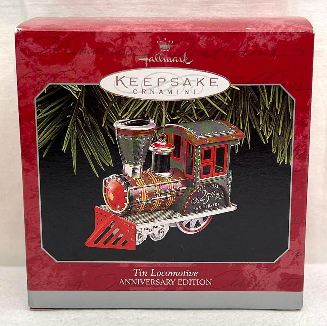 Hallmark Keepsake Ornament Tin Locomotive Anniversary Edition: Hallmark Keepsake Ornament Tin Locomotive Anniversary Edition. This lot includes, 1998 Tin Locomotive. Ornament appears new, never displayed Mint condition. Box shows little to no wear. Ornaments are 