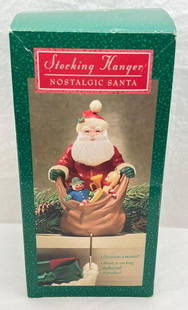 Hallmark Keepsake Ornaments Stocking Hanger Nostalgic Santa: Hallmark Keepsake Ornaments Stocking Hanger Nostalgic Santa. This lot includes Nostalgic Santa Stocking Hanger. Ornament is used but in excellent condition. Box is in great shape with little wear.