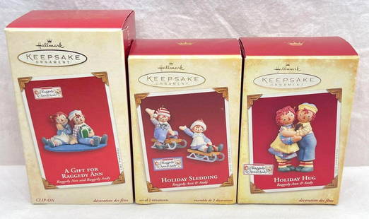 Hallmark Keepsake Ornaments Raggedy Ann and Andy lot of three Holiday Hug Holiday Sledding and more: Hallmark Keepsake Ornaments Raggedy Ann and Andy lot of three Holiday Hug Holiday Sledding and more. This great lot has three Raggedy Ann and Andy ornaments. This lot includes, 2003 A Gift For