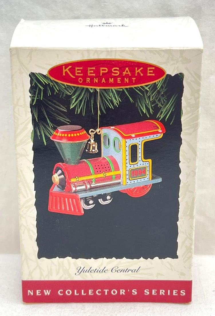 Hallmark Keepsake Ornaments Yuletide Central first in the series: Hallmark Keepsake Ornaments Yuletide Central first in the series. This lot includes, 1994 Yuletide Central, first in the Yuletide Collector's Series. Ornament is in excellent condition. Box shows 