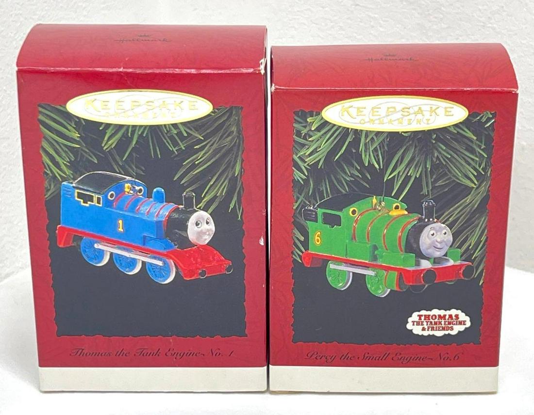 Hallmark Keepsake Ornaments set of two Thomas the Tank Engine and Friends: Hallmark Keepsake Ornaments set of two Thomas the Tank Engine and Friends. This great lot includes, 1995 Thomas the Tank Engine No.1, 1996 Percy the Small Engine No.6. Ornaments are in Mint, never rem