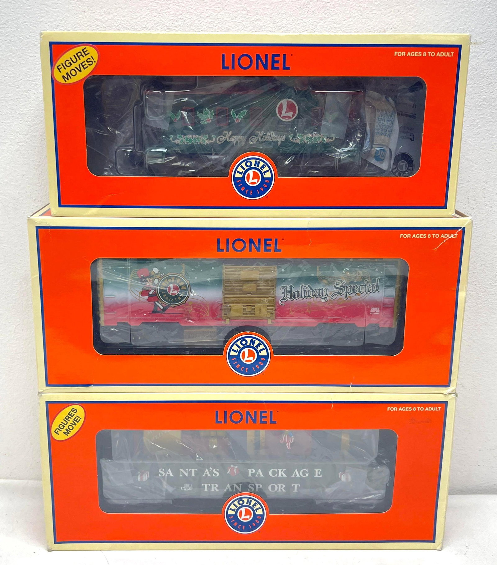 Modern Era Lionel O Gauge 36803 26819 26858 Christmas freight in original boxes: Modern Era Lionel O Gauge 36803 Santa animated caboose, 26819 Christmas animated gondola, 26858 Christmas music boxcar, freight trains in original boxes, C8 light run time. Boxes show little to very l