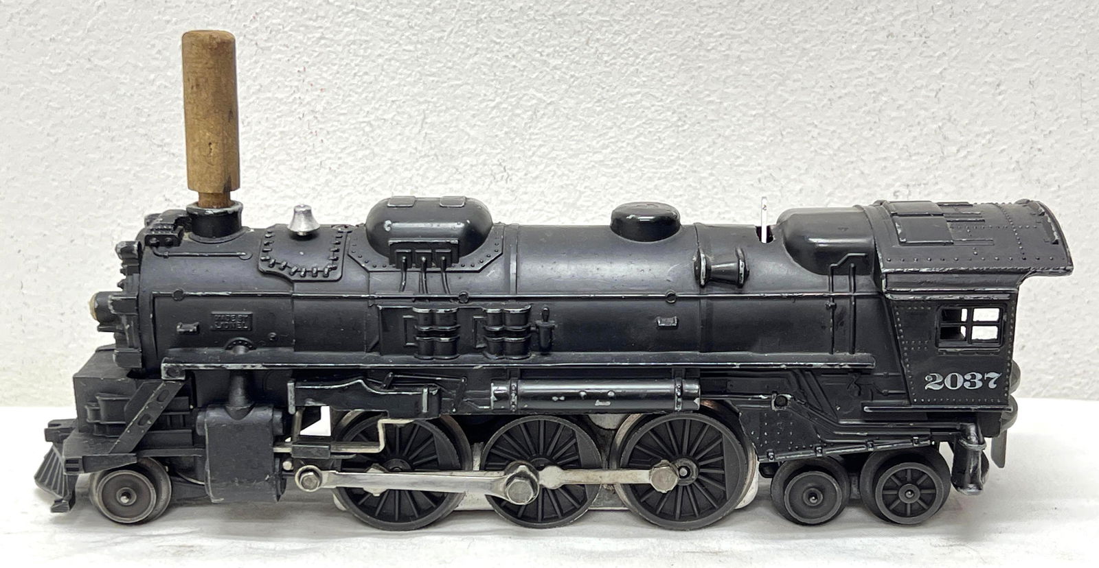 Postwar Lionel O Gauge 2037 2-6-4 steam locomotive with pellet tamper: Postwar Lionel O Gauge 2037 2-6-4 steam locomotive with pellet tamper, shell has older marker touchups, C6+.