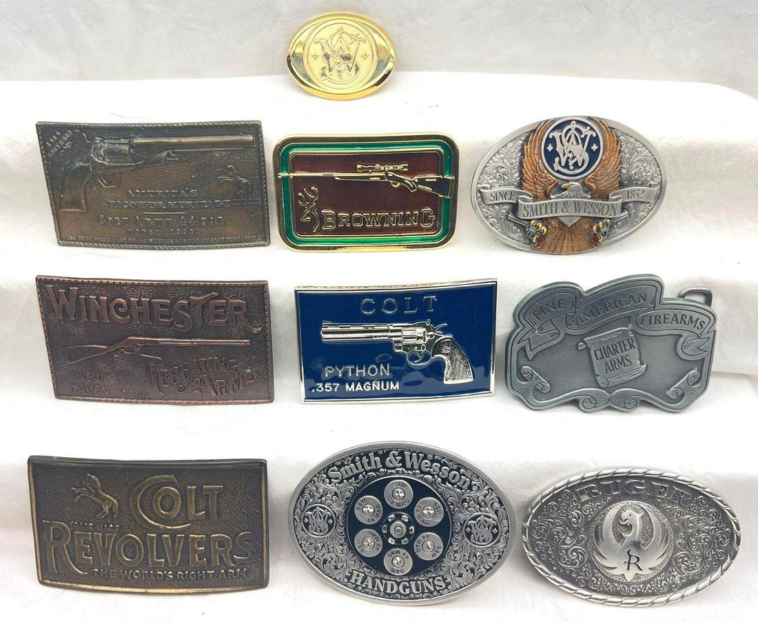 Ten Handgun and Rifle Belt Buckles Smith and Wesson Winchester and More: Ten Handgun and Rifle Belt Buckles Smith and Wesson Winchester and More. This great lot includes, Winchester Repeating Arms buckle, bronze look, no markings, American Pioneer Heritage Colt Army , Colt