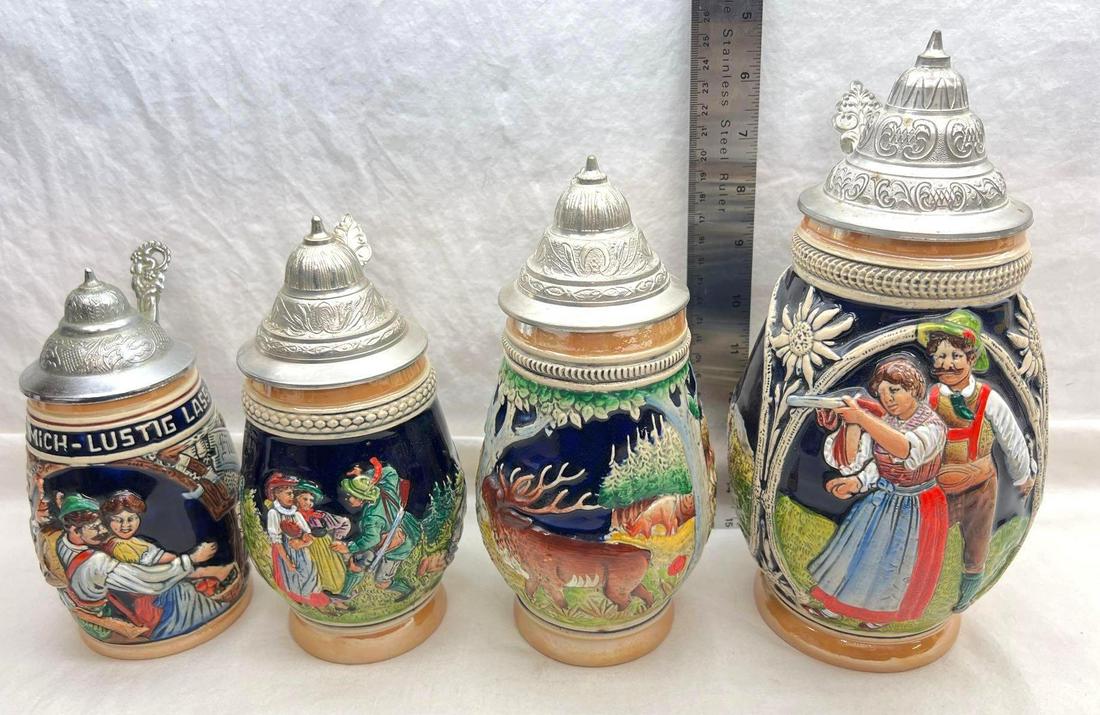 Four DBGM Beer Steins: Four DBGM Beer Steins. Each stein has been displayed but never used. No chips or cracks. Woman holding gun stein measures approximately 11 inches at tallest point. Moose with hunter stein measures app