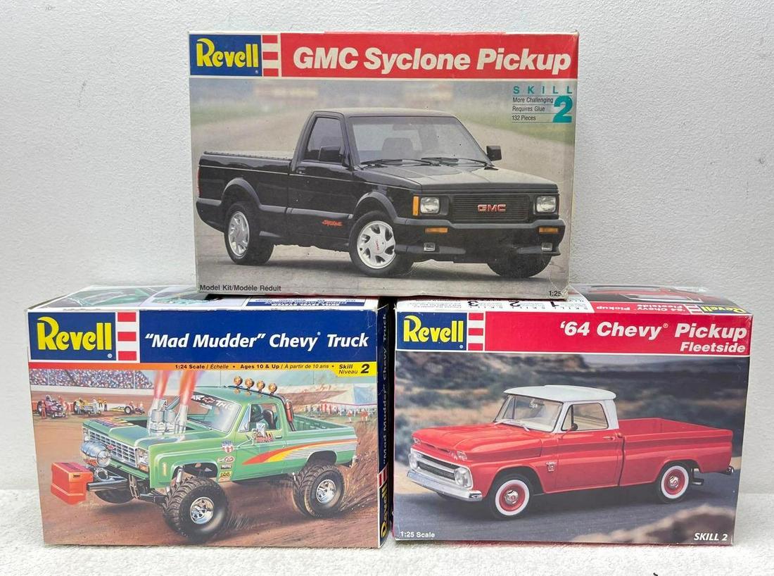 Revell 85-2584 7435 7613 1:24/1:25 kits in original boxes: Revell 85-2584 "Mad Mudder" Chevy Truck, kit appears complete except tires, parts on sprue, instructions sheet, decals, sheet. 7435 GMC Syclone Pickup, kit appears complete with parts on sprue