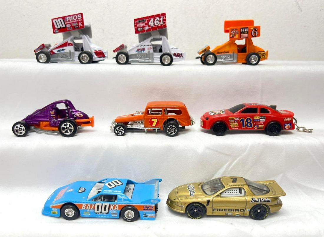 1:64 Racing Champions ZEE Toys Action Hot Wheels Race Cars open wheel wing: 1:64 scale die-cast Racing Champions, ZEE Toys, Action, Hot Wheels, and a battery powered key chain. One open wheel winged car has detached wing, key chain car does not make sounds. Toy vehicles were