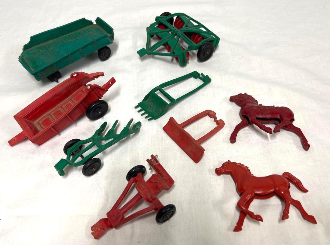 Auburn Rubber farm implements horses manure: Auburn Rubber farm implements, manure spreader, disc, wagon, two tractor front mount blades/buckets. All pieces have some damage. Two plastic unmarked horses, one is missing tail. Please view the phot