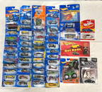 Fifty-six Hot Wheels die-cast cars on card with variations