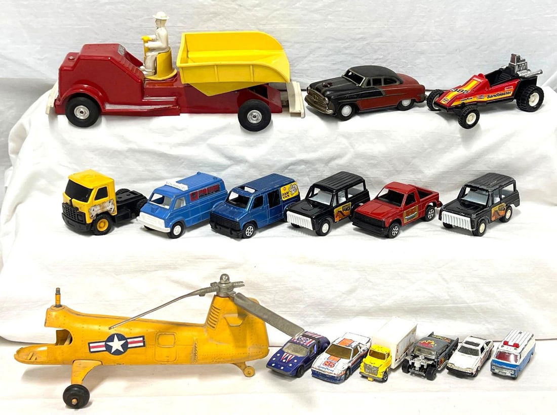 Saunders Hubley Tootsietoy Buddy L Matchbox Tomica: Saunders plastic and tin dump truck, Hubley Kiddie Toy Air Force helicopter, Tootsietoy pressed steel trucks, Buddy L pressed steel and plastic vehicles, Matchbox cars, Tomica die-cast vehicles and a