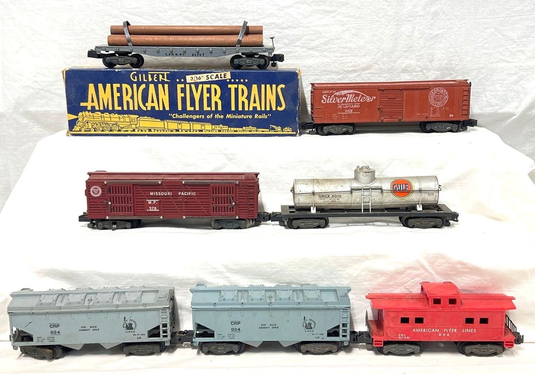 Postwar American Flyer S Gauge 928 976 925 924 924 942: Postwar American Flyer S Gauge freight cars; 928 C&NW log car, 976 operating Missouri Pacific cattle car, 925 Gulf tank car, 924 Jersey Central Lines covered hopper, 924 Jersey Central Lines cover