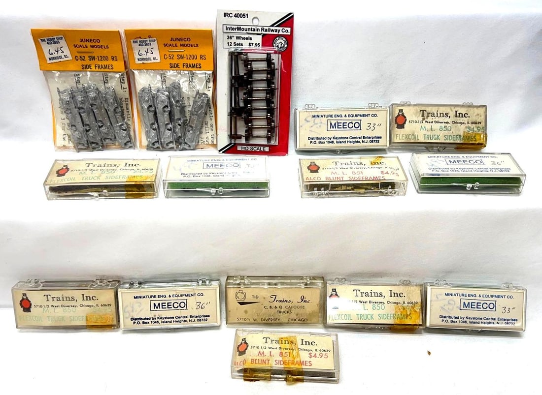 HO Gauge Intermountain Mecco Trains Inc brass trucks: HO Gauge Intermountain and Trains Inc brass trucks/truck side frames, more. Two packages of Juneco Scale Model C-52 SW-1200 RS side frames, NIP. Three Meeco packs of 33" wheel sets. One Meeco pack