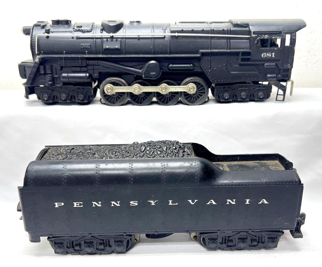 Postwar Lionel O Gauge 681 6-8-6 turbine 2671WX Pennsylvania: Postwar Lionel O Gauge 681 6-8-6 steam turbine locomotive with 2671WX Pennsylvania whistle tender, should clean C7. Please view the photos of the items in this lot carefully as they are being sold as 