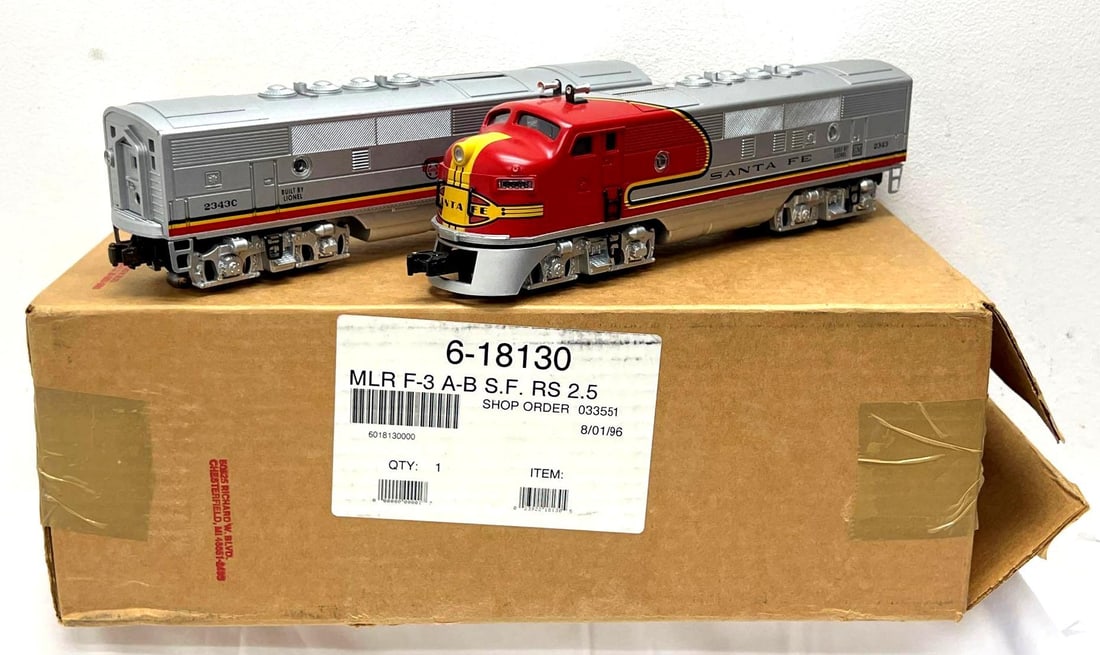 Lionel 18130 2343 Santa Fe F3 A-B diesels in box: Modern Era Lionel O Gauge 18130 2343 Santa Fe F3 A-B diesel locomotive units in original boxes in original shipper with instructions. Trains show very light run time, C8. Boxes show no wear. Please vi