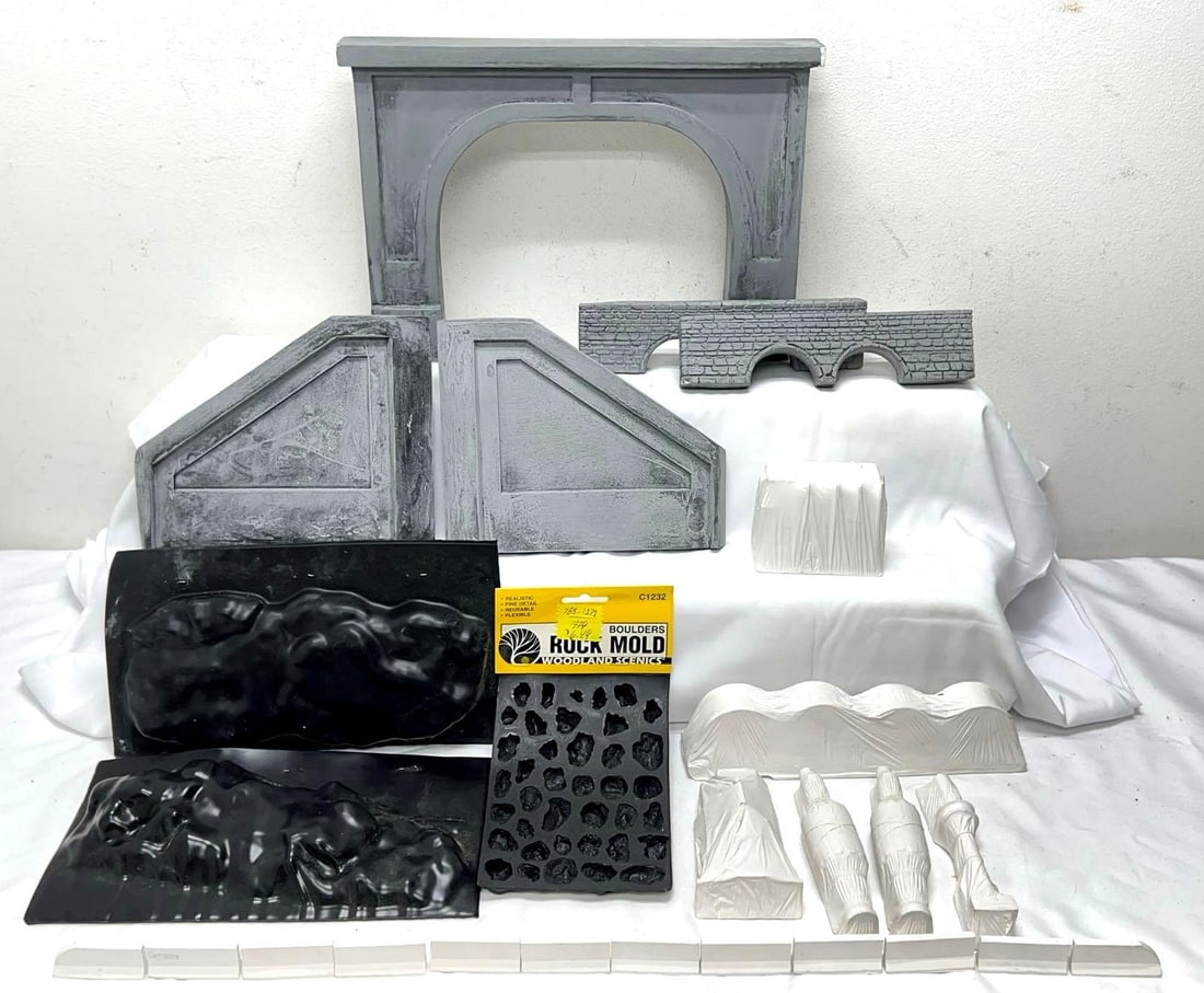 Plaster O Gauge car loads Woodland Scenics molds More: Plaster O Gauge car loads that are nicely made but unmarked, Woodland Scenics molds, tunnel portals and other pieces. Most items are unused but a few have chips or rubs. Please view the photos of the