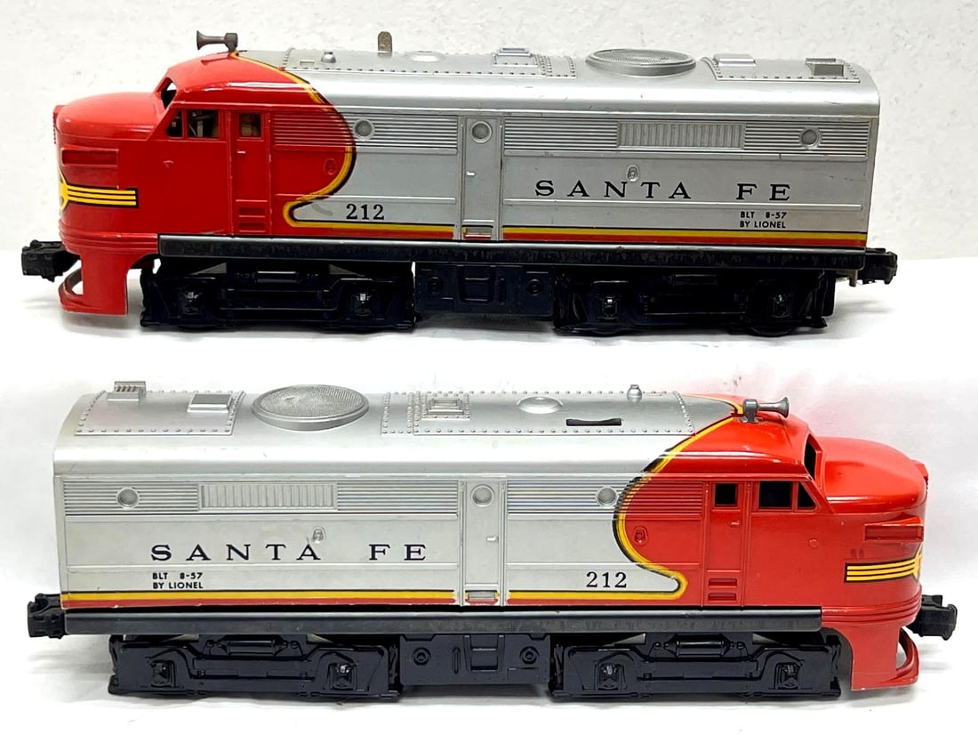 Postwar Lionel O Gauge 212 Santa Fe Alco diesel A units: Postwar Lionel O Gauge 212 Santa Fe Alco diesel A units, powered and dummy, C6+. Please view the photos of the items in this lot carefully as they are being sold as they are shown in our photos wi