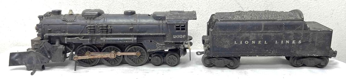 Postwar Lionel O Gauge 2026 2-6-4 steam 6466W whistle tender parts/resto: Postwar Lionel O Gauge 2026 2-6-4 steam locomotive and 6466W Lionel Lines whistle tender. Tender looks C6. Loco has missing parts and should be considered for parts or restoration. Please view the pho
