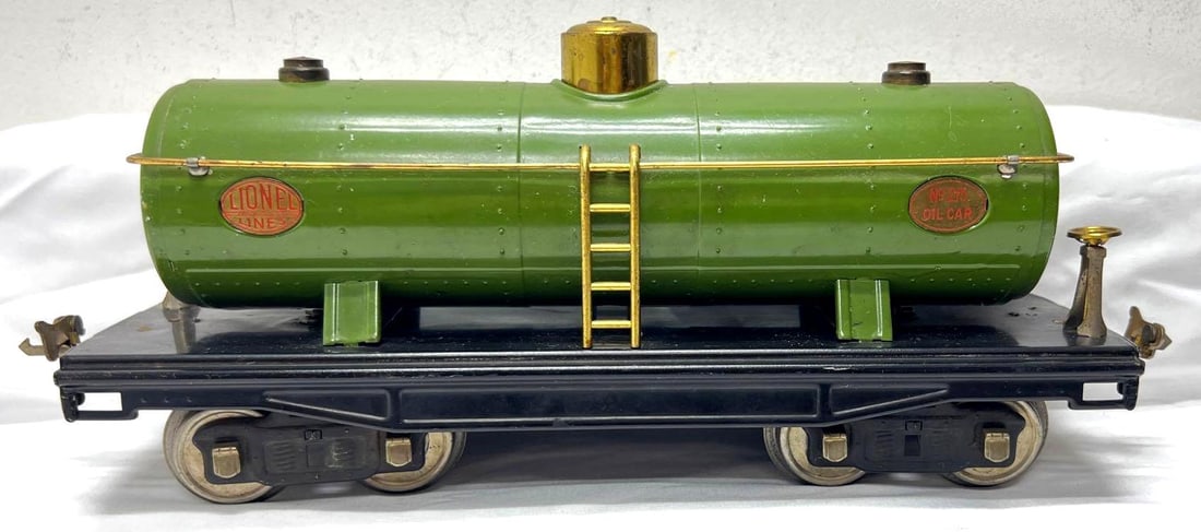 Prewar Lionel Standard Gauge 215 Pea Green Tank car: Prewar Lionel Standard Gauge 215 Pea Green Tank car with brass plates (black lettering) and trim, nickel journals. Train should clean and polish C7. Please view the photos of the items in this lot car