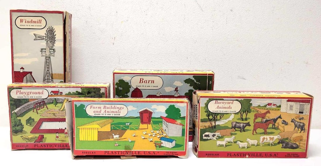 Plasticville 1406 1408 1601 1606 1617 in boxes: Bachmann Plasticville O&S Gauge 1406 Playground, 1408 Windmill, 1601 Barn, 1606 Barnyard Animals and 1617 Farm Buildings & Animals in original boxes. Kits appear complete and undamaged. Boxes 