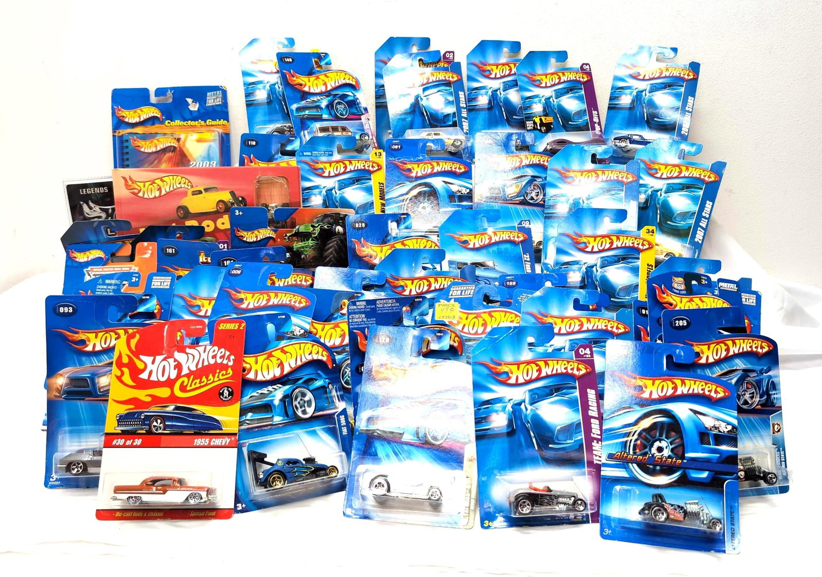 Fifty-Six Hot Wheels die-cast cars on card w/variations: Fifty-six Hot Wheels die-cast cars on card with variations. Cars have never been removed packages, some cards have some warping, some dust, excellent overall condition on the group. Please view the ph