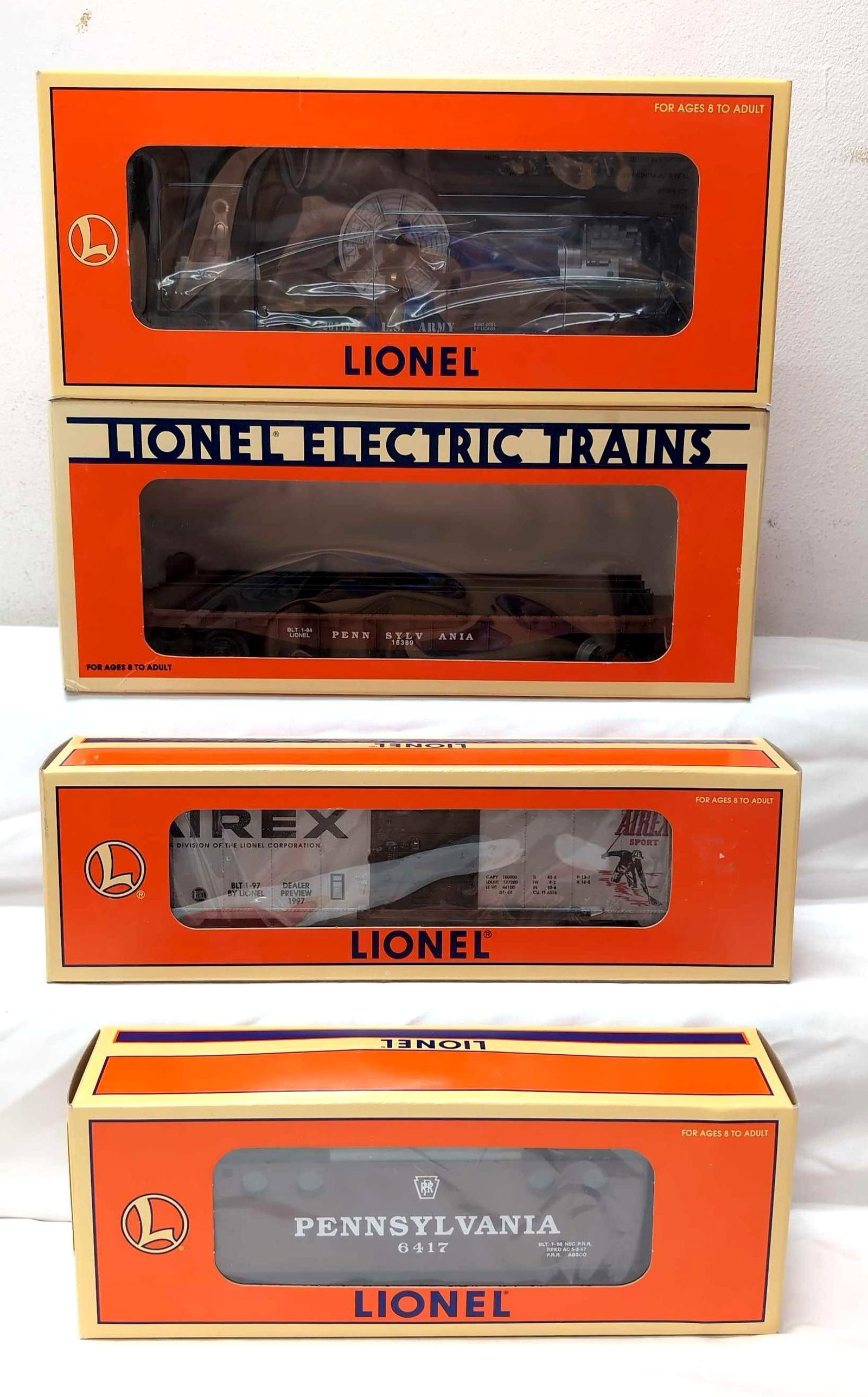 Modern Lionel O Gauge 19741 29217 16389 26775: Modern Era Lionel O Gauge 19741 Pennsylvania N5c caboose, 29217 1997 Toy Fair Boxcar, 16389 Pennsylvania Wheel Car and 26775 US Army Extension Searchlight Car, trains look C8-9 little to no run time, 