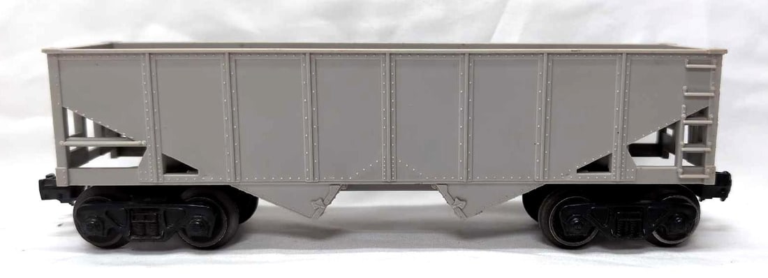 Postwar Lionel O Gauge undecorated 6076-100 gray mold: Postwar Lionel O Gauge undecorated 6076-100 gray mold hopper with Timken roller bearing trucks, C7.