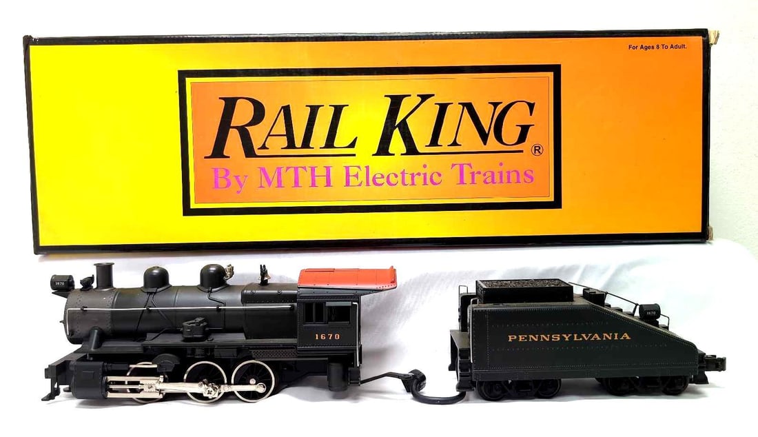 Modern Rail King O Gauge 30-1170-0 PRR 0-6-0 B6 in box: Modern Era Rail King O Gauge 30-1170-0 Pennsylvania PRR 0-6-0 B6 steam switcher locomotive in original box with LocoSound. Train has display dust, should clean C8 with run time on wheels and rollers,