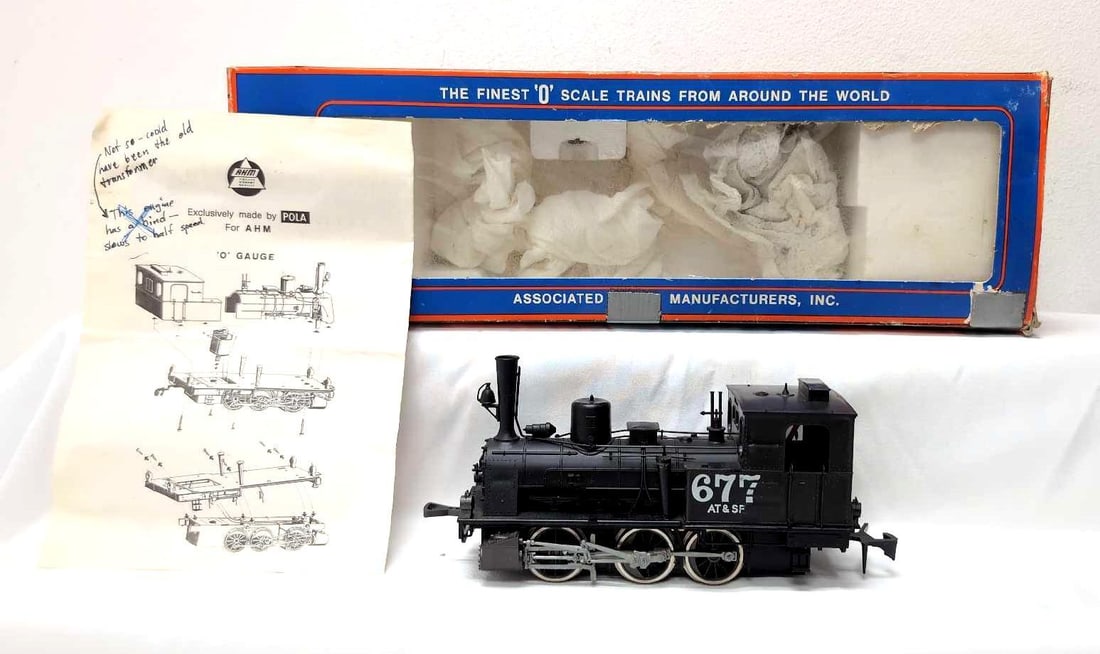 AHM Pola Maxi O Scale 2-Rail 7111C AT&SF 0-6-0T in box: AHM Pola Maxi O Scale 2-Rail 7111C AT&SF 0-6-0T steam locomotive in original box with original instructions and hand written notations about loco. Train looks nice C7+ with run time on wheels. Box sho