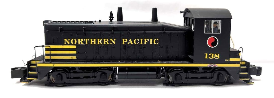 Modern S-Helper S Gauge Northern Pacific number 138 diesel switcher: Modern Era S-Helper S Gauge Northern Pacific cab number 138 diesel switcher (SE-12), minor rubs to cab roof, train looks C7+.