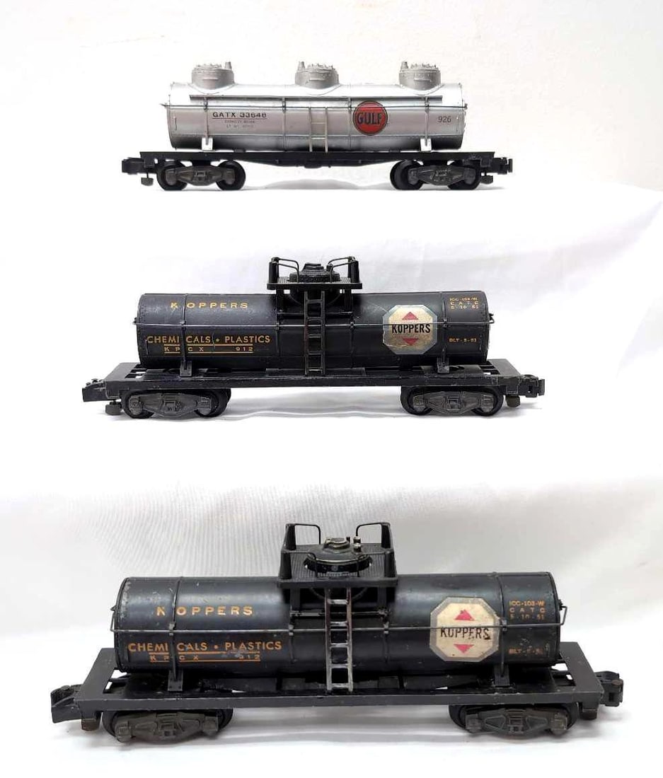 Postwar American Flyer S Gauge 926 Gulf 3D two 912 Koppers tank cars: Postwar American Flyer S Gauge 926 Gulf three dome and two 912 Koppers tank cars. Both 912 have some rust on hand rails, one has some super tiny green specks. Trains should clean and polish, C6.
