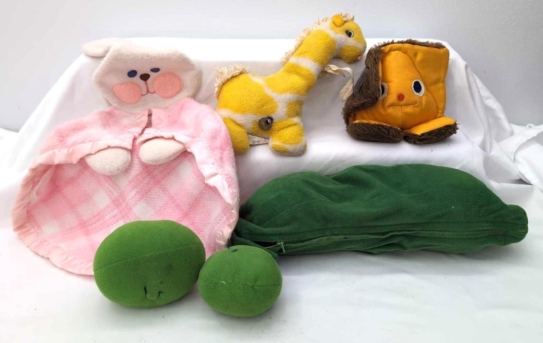 Fisher Price Freemountain Toys Eden Toys: Fisher Price, Freemountain Toys and The Vegimals and Eden Toys plush toys. Eden toys is a windup toy that articulates the giraffe's head and plays a song via an internal music box. Freemountain zip up