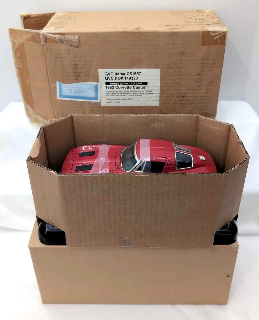 QVC Ertl 1:18 32052 1963 Corvette Custom MIB: QVC Ertl Collection 1:18 scale die-cast 32052 1963 Corvette Custom with side pipes, mag wheels and black interior, MIB. Car is Mint in original box, open box, may or may not have been removed from box