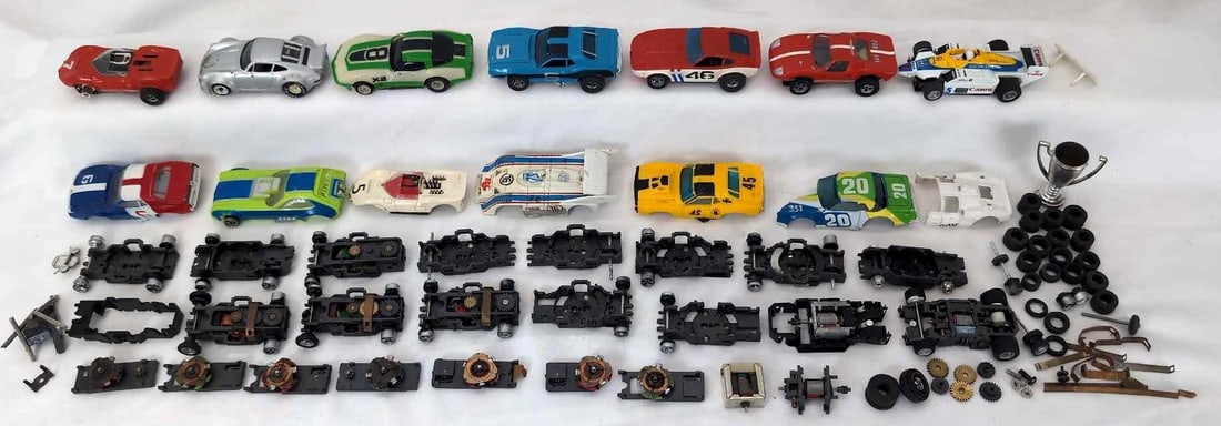 Tyco Slot Cars and Parts lot: Tyco slot cars. This lot has six cars with a couple missing wheels. This lot also has many chassis with no body. Four bodies with no chassis. Loose tires and more. Cars have not been tested. Please vi