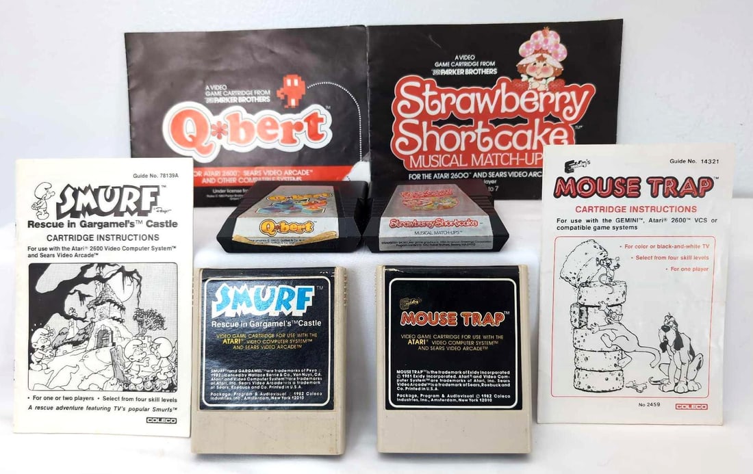 Four Atari Game Cartridges Smurf Qbert and More: Four Atari Game Cartridges Smurf Qbert and More. This lot includes: 1982 Coleco Smurf Rescue in Gargamels Castle, with instructions; 1983 Gottlieb Q*bert, with instructions; 1982 Coleco Mouse Trap, wi