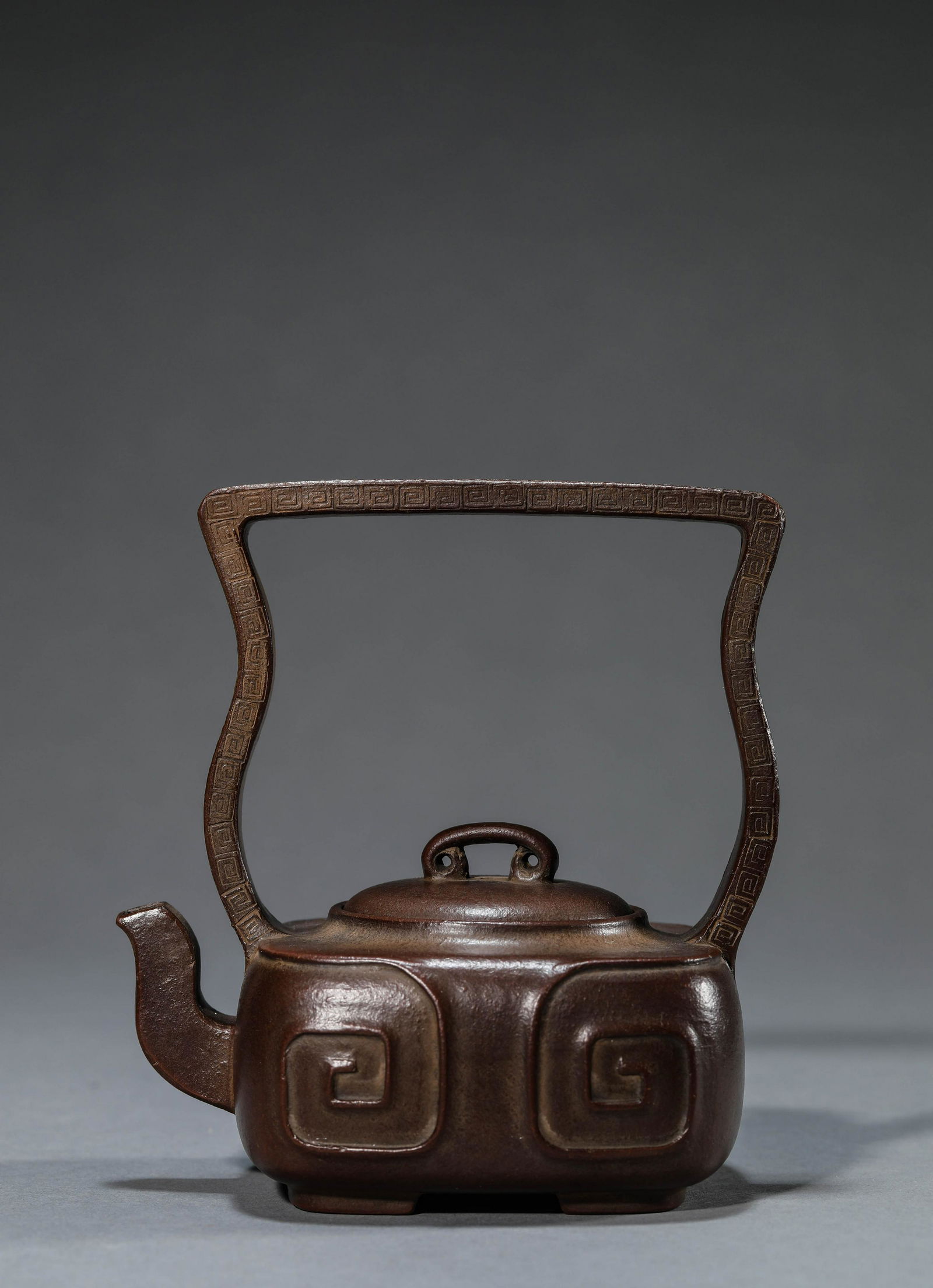 A Chinese Redware Teapot and Cover: L:13cmW ï¼š 8.8cmH ï¼š 13.7cm