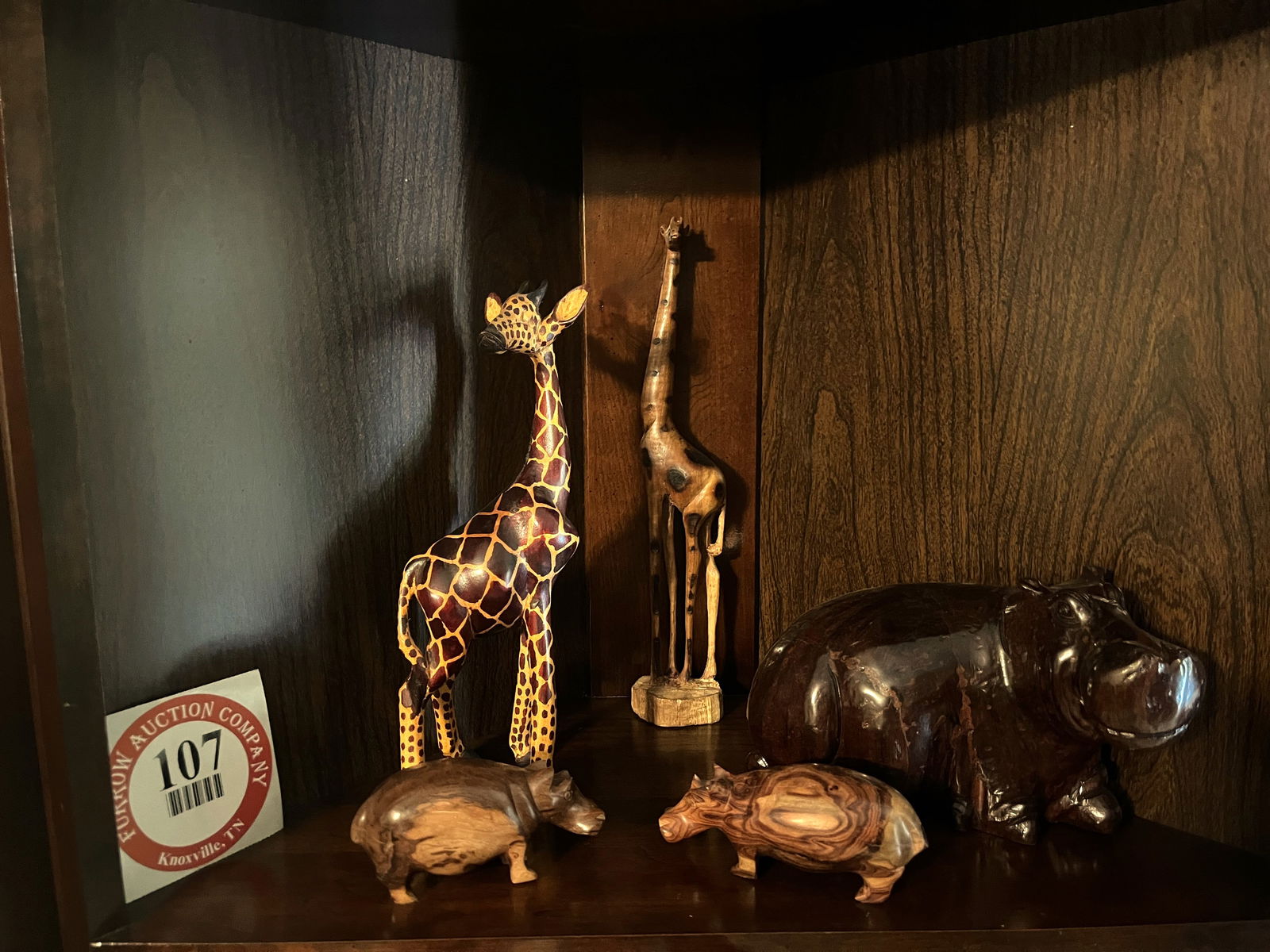 Contents of Shelf, 2 Carved Wooden Giraffes, 3 Carved Wooden Hippos (2 small, 1 large) (1 of 1)