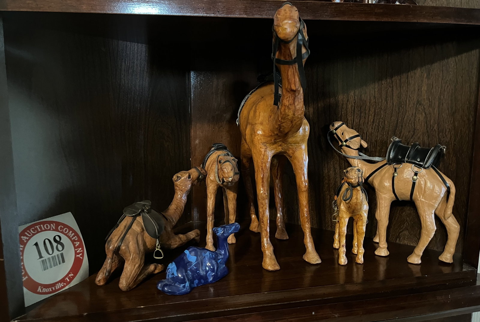 Contents of Shelf, 5 Carved Wooden Camels & 1 Glass Camel: Contents of Shelf, 5 Carved Wooden Camels & 1 Glass Camel
