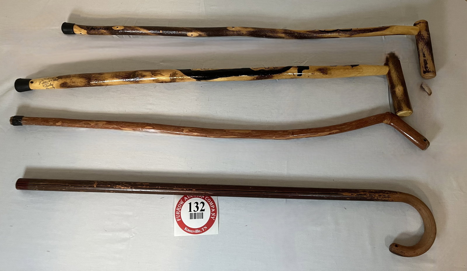 (2) Steve Newman Walking Sticks (2017 & 2019) plus 2 Additional Wooden Walking Sticks, All Approx: (2) Steve Newman Walking Sticks (2017 & 2019) plus 2 Additional Wooden Walking Sticks, All Approx 36" L