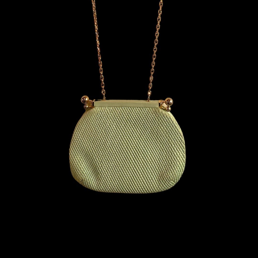 Judith Leiber Vintage Leather Frame Clutch: Vintage Judith Leiber Evening BagGreen Twist Tucked LeatherGold-Tone HardwareChain-Link Shoulder StrapSatin Lining & Dual Interior PocketsKiss-Lock Closure at TopIncludes Original Comb and Compact Mir