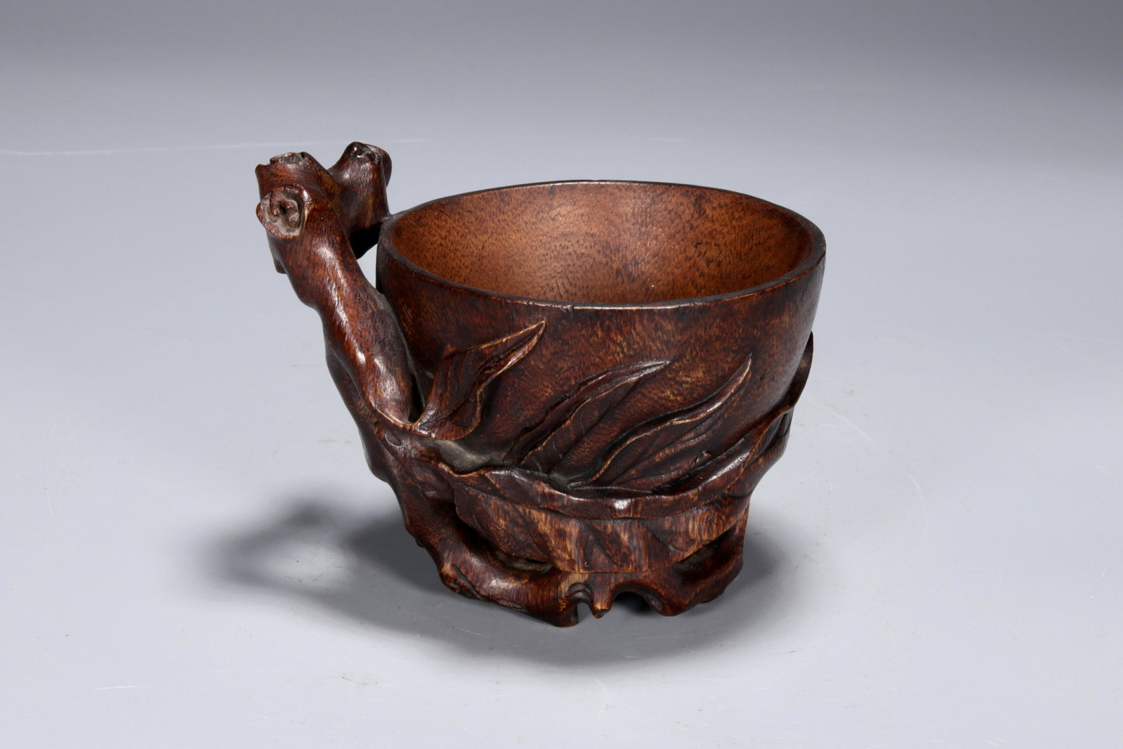 A Carved Bamboo Vessel: A Carved Bamboo 'Flower' Vessel.Size:10cmx7.7cmx8.2cm