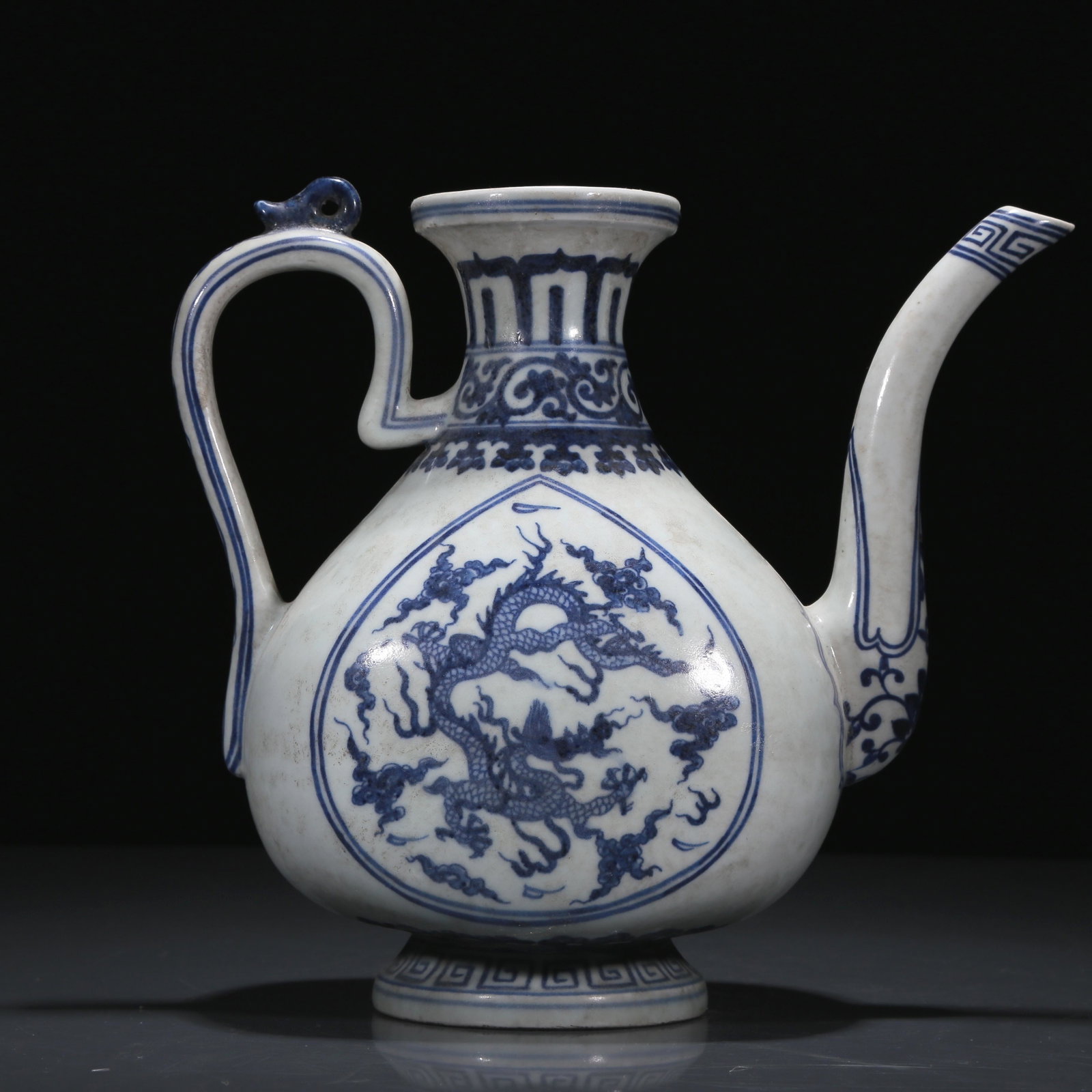 A Blue and White 'Dragon' Ewer: A Blue and White 'Dragon' Ewer. Chinese Ming Dynasty. Xuande Six-Character Mark. Size:22cmx25cmx12cm