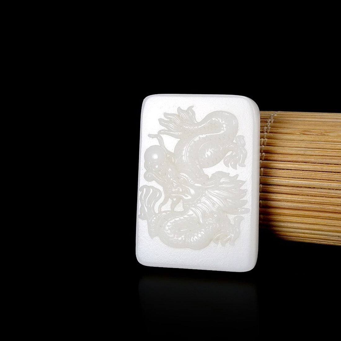 A Fantastic White Jade 'Dragon' Pendant (1 of 4)