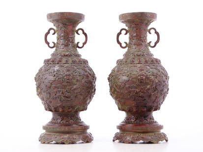 A pair of exquisite copper amphora with auspicious clouds and dragon patterns: A pair of copper amphora with auspicious clouds and dragon patterns, Ming Dynasty, China. The surface has been carefully carved, vividly demonstrating the superb skills of the craftsmen. It has its ow