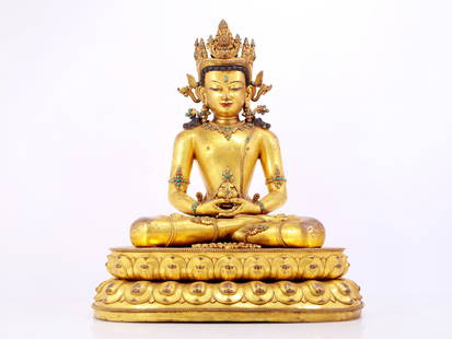 A solemn gilt bronze statue of Amitayus Buddha inlaid with hundreds of treasures: solemn gilt bronze statue of Amitayus Buddha inlaid with hundreds of treasures, from the Ming Dynasty in China. The Buddha's face has clear outlines, deep eyes, a solemn and kind expression, and the c