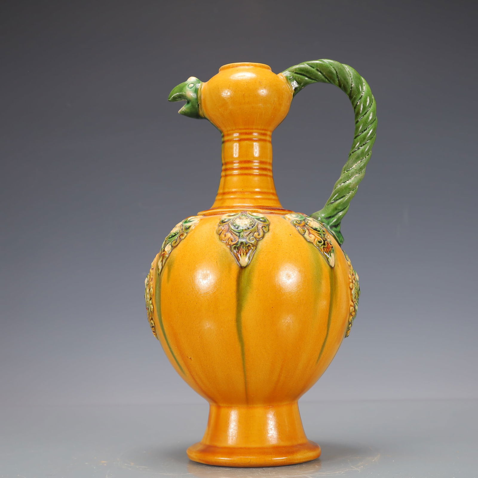 A Exquisite Trio-colored glazed pottery of the Tang Dynasty Flower Pattern Ewer : A Exquisite Trio-colored glazed pottery of the Tang Dynasty Flower Pattern Ewer Tang Dynasty, China Size:17cmx17cmx30cm Weight:1200g唐三彩花卉纹执壶 