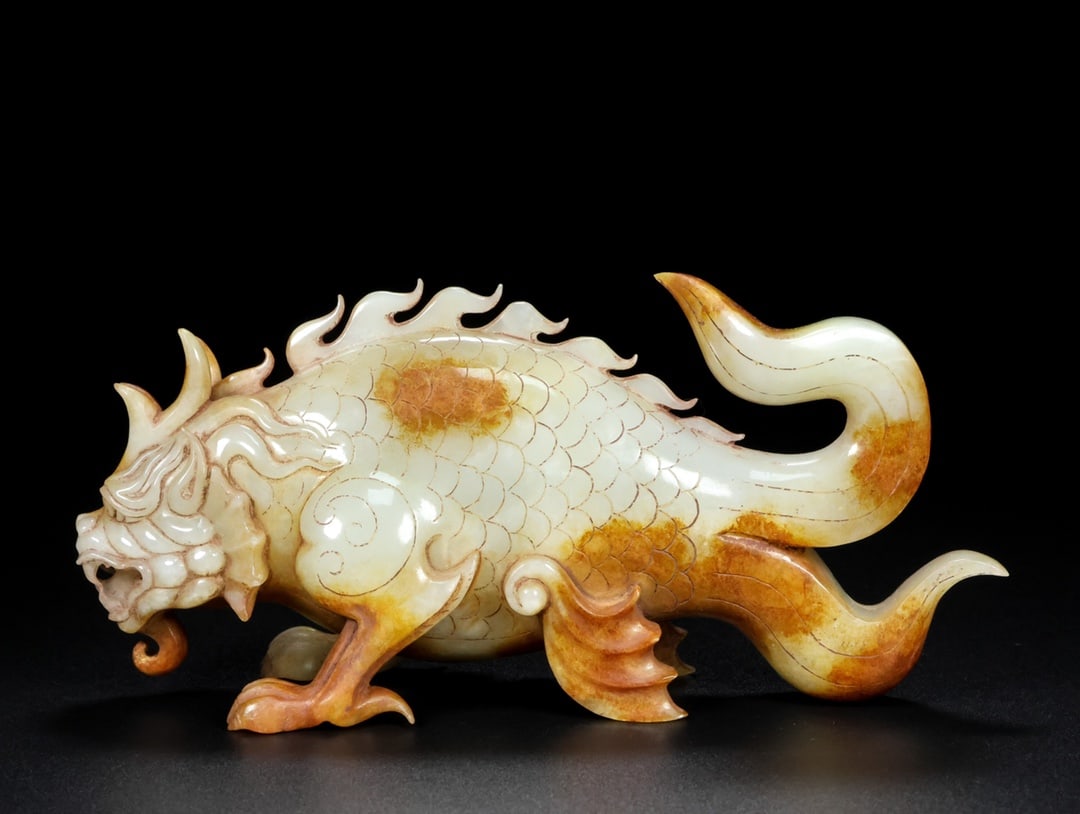 A Rare White Jade Dragon Fish Ornament (1 of 9)